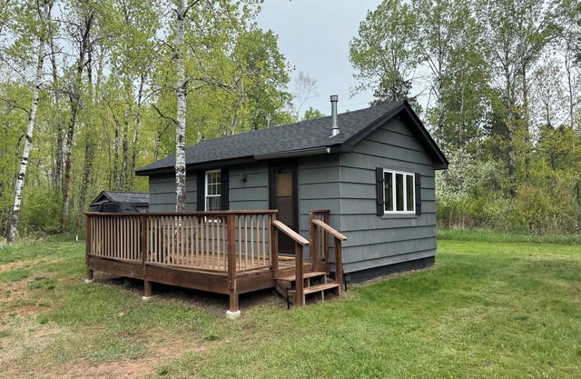 Charming cabin in delightful Duquette with AC near miles of ATV trails.