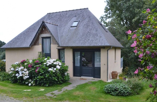 Charming house with balcony on green hill