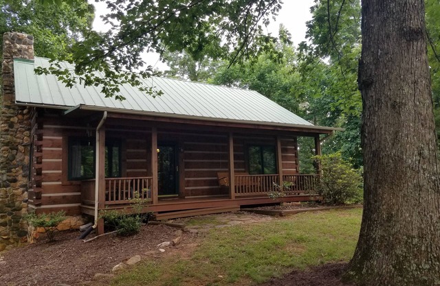 Charming Log Home with Pond on 27 Acres with Mountain Views