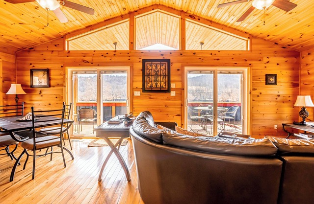 Charming riverside with stunning views, cozy interiors, full amenities, and spacious decks.