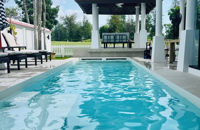 Coastal bliss: bright, breezy family villa on a golf course near beach & town.