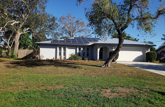 Comfortable updated 3 bedroom home - enclosed, solar heated pool, private yard.