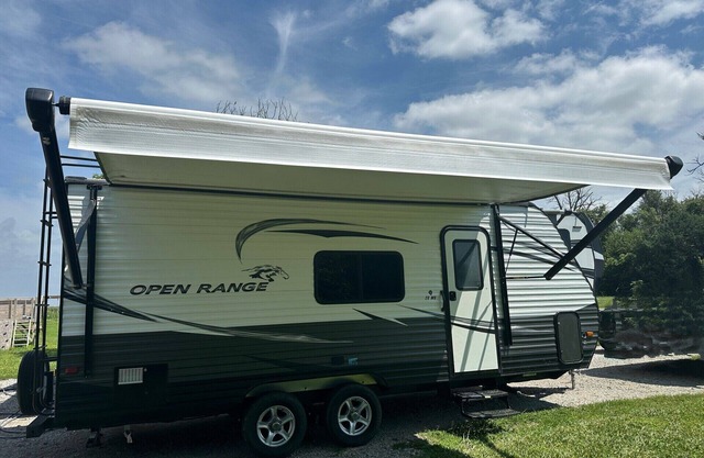 Cozy camper with queen Murphy bed, bunks, and dinette conversion bed.