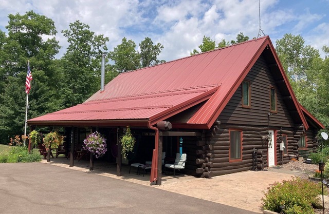 Custom built log home on 40 acres & in the woods!nSnowmobile right from home!