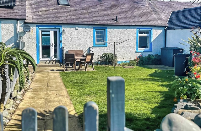 Delightful cottage overlooking Luce Bay, with open fire and enclosed garden.