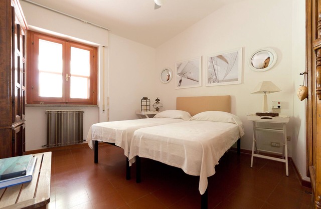 Designer villa with splendid bay view of Punta Ala, two terraces and garden.
