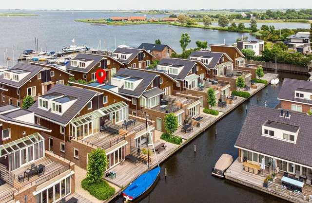 Directly on the waterfront welcomes you this modern and bright vacation home in Uitgeest.