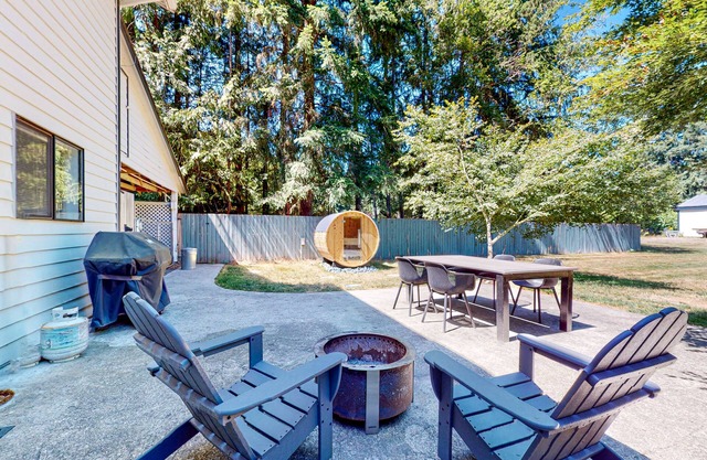 Dog-friendly downstairs retreat with outdoor sauna, full kitchen, firepit, patio