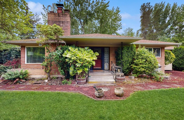Dog-friendly home on 1/2 acre with creek access, game room & 2 fireplaces