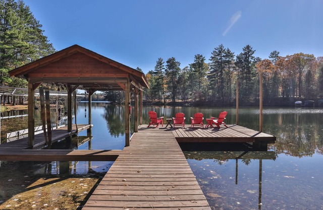 Dog-friendly, lakefront lodge in the woods with large dock, central AC, & canoe