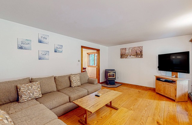 Dog-friendly rural home near beach with firepit, porches, grill, & pellet stove