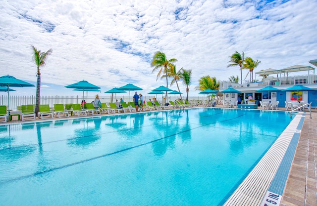 Enjoy the manatees off the 75’ dock w/Cabana Club Access on Gulf near Atlantic