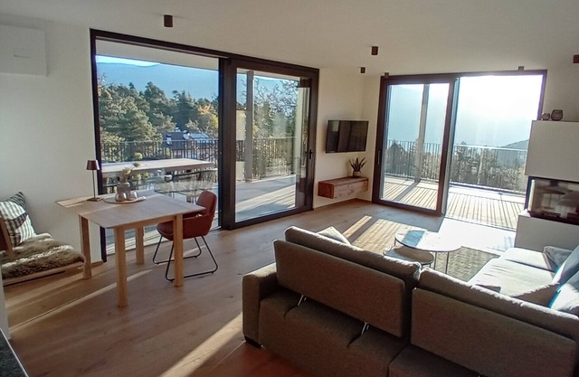 Exclusive panoramic apartment with fireplace! Centrally located between Merano and Bolzano.