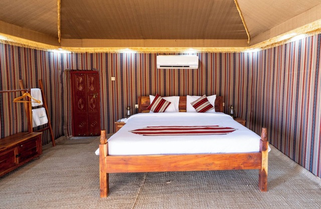 Experience Wahiba in the comfort of our Premium Tents at Thousand Nights Camp