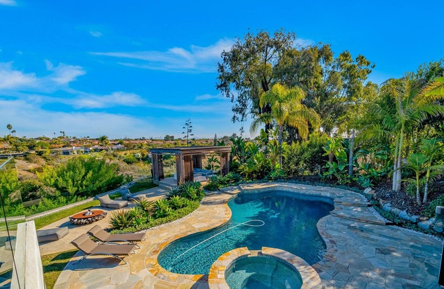 Exquisite home with pool, sauna, hot tub, 3 fireplaces, balcony, & washer/dryer