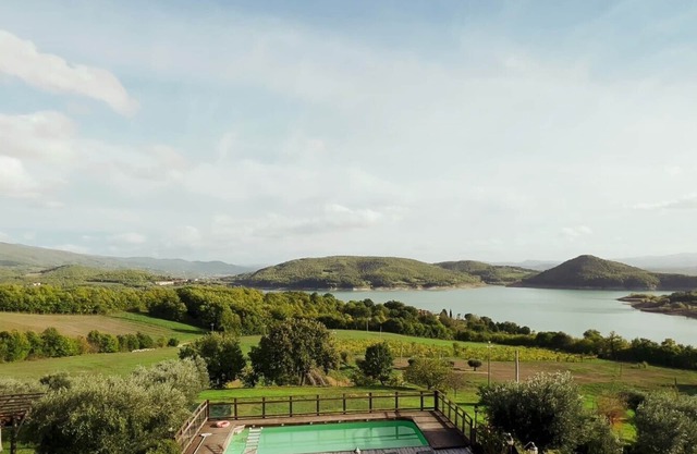 Family-friendly organic farmhouse, authentic Tuscan experiences, lake-view pool