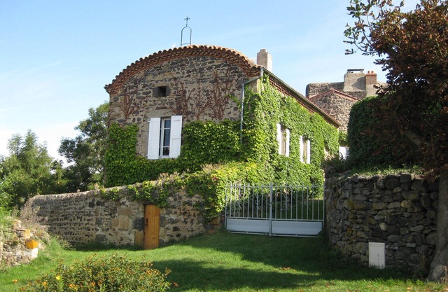 Former priory with garden, located above the village