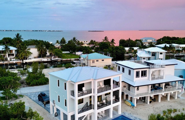 Gorgeous new build on Cudjoe Marina Basin with 80 ft boat dock and private pool