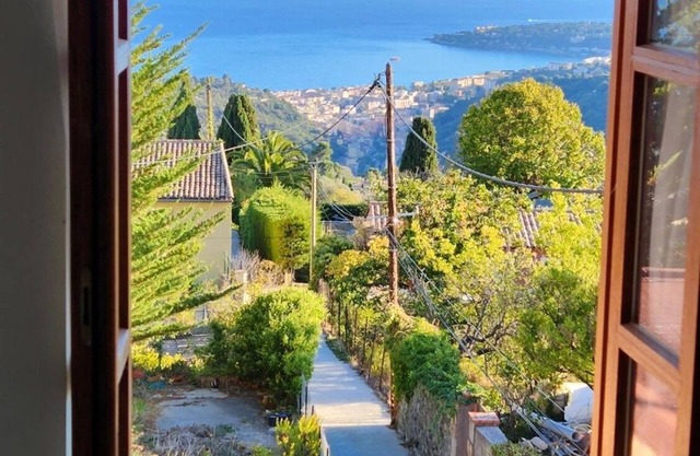 Hilltop Village Apartment with Superb Sea and Mountain Views