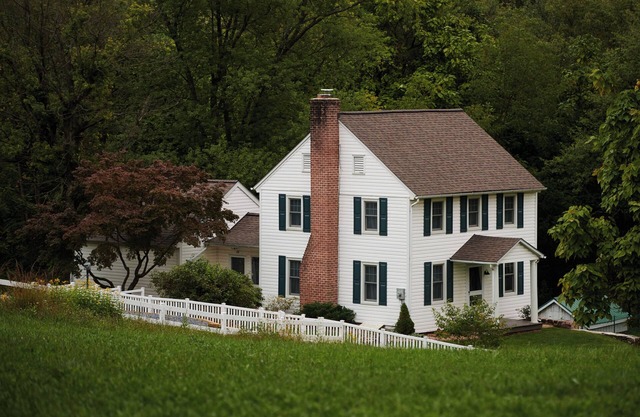 Historic two-story log farmhouse with first-floor master suite and AC