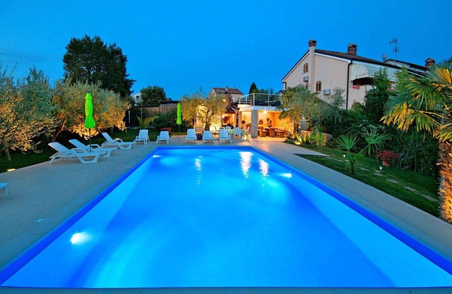 Holiday apartment with sea view and pool