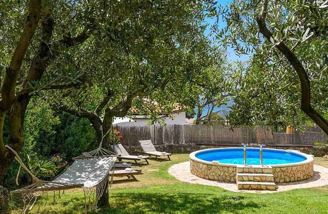 Holiday home with pool and large garden to relax in