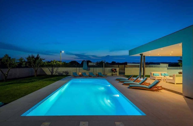 Holiday home with pool and sun loungers