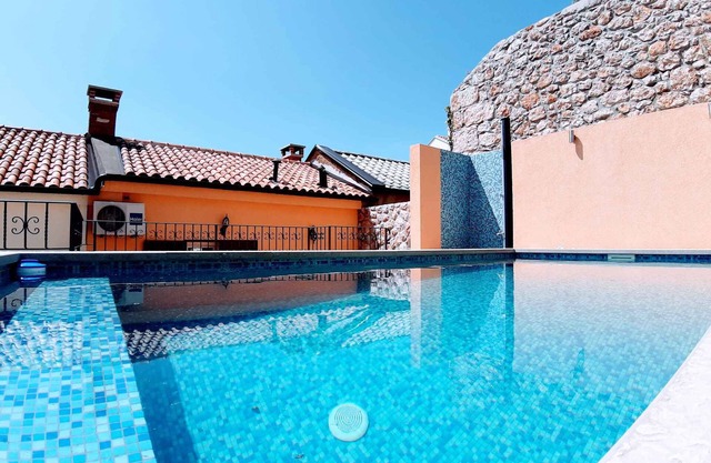 Holiday home with swimming pool, sauna and air conditioning