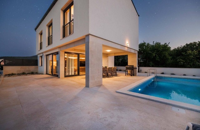 Holiday house with a swimming pool Vrbnik, Krk (K-24526)