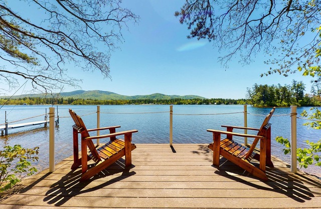 Homey lakeside property w/one house, two cottages, mtn. views, & private beach