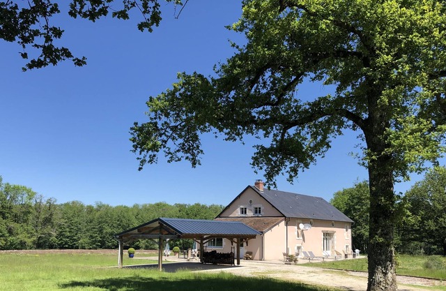 House in the heart of a clearing in the forest with private pond for fishing