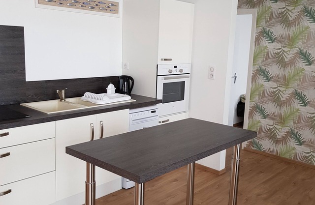 House with enclosed garden, on the sea side