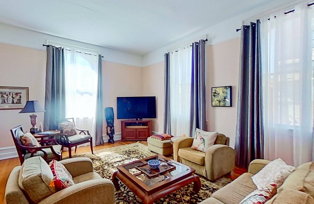 Iconic river-view condo with AC, W/D, & historic charm - dog-friendly