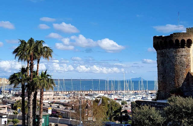 In the center. 50m from port and beaches. 100m from the station. trains every hour to Rome
