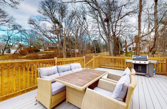 Inviting home + apartment near beach with furnished deck, yard, & grill