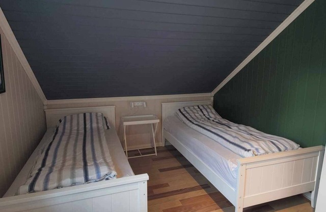 Island house room Shared entrance with hosts Two single beds + sofa bed Small kitchen