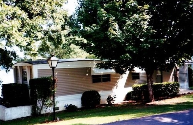 Keowee lakefront view with large yard and dock for boat up to 30' long