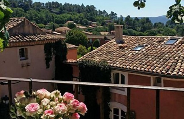 "LA DAME AU BALCON" on the village square