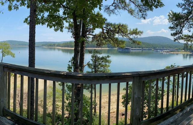 Lake view two bedroom, two bath loft, log-sided cottage with private hot tub overlooking Lake Ouachita. by RedAwning