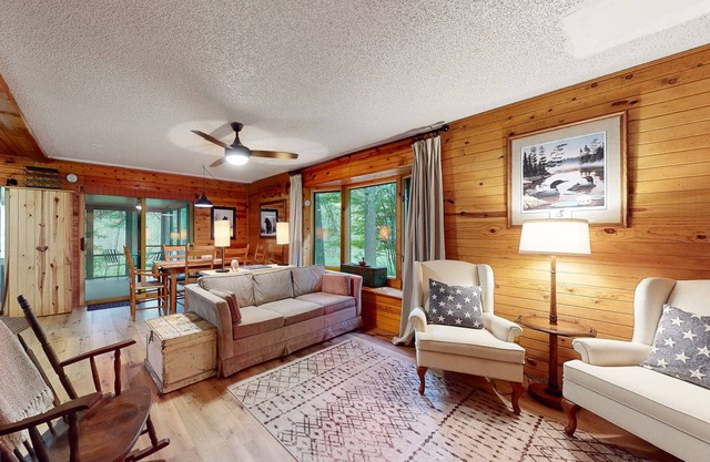 Lakefront cabin with kayaks, firepit, dock & spacious interior