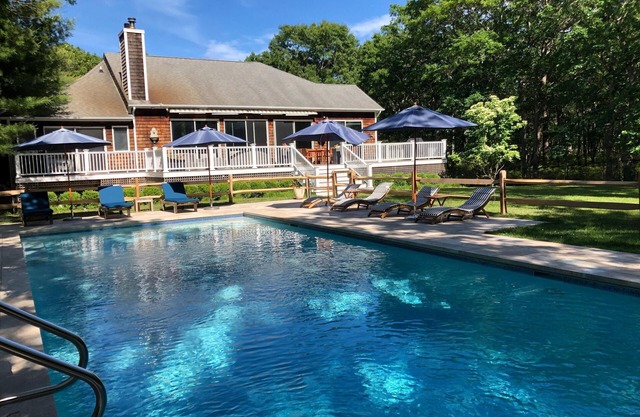 Large 5 bedroom/5 bath secluded property with large heated pool on over an acre
