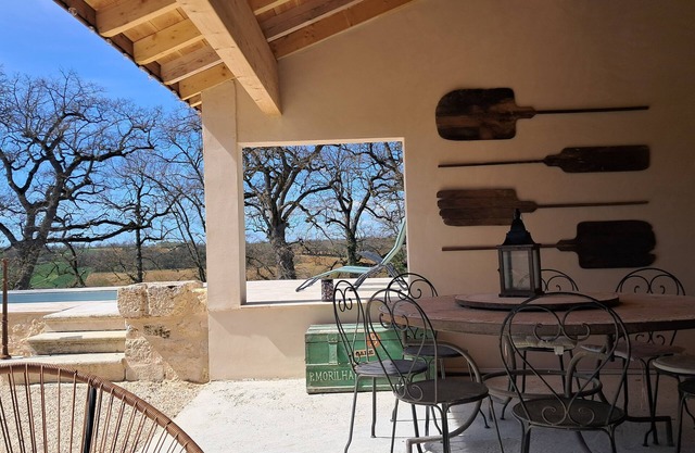 Large stone gîte for 12 people, swimming pool and boules pitch.