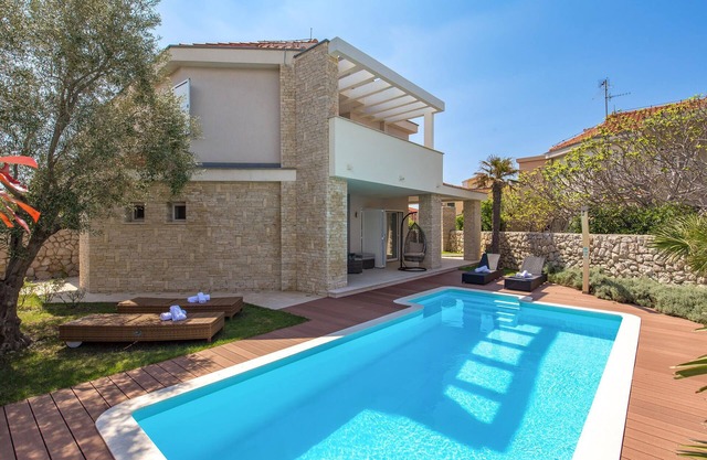 Look forward to a vacation in this fantastic house with sea view in Pag-Novalja.