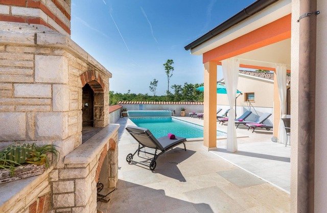 Look forward to vacationing in this vacation home with pool and views of the green surroundings!