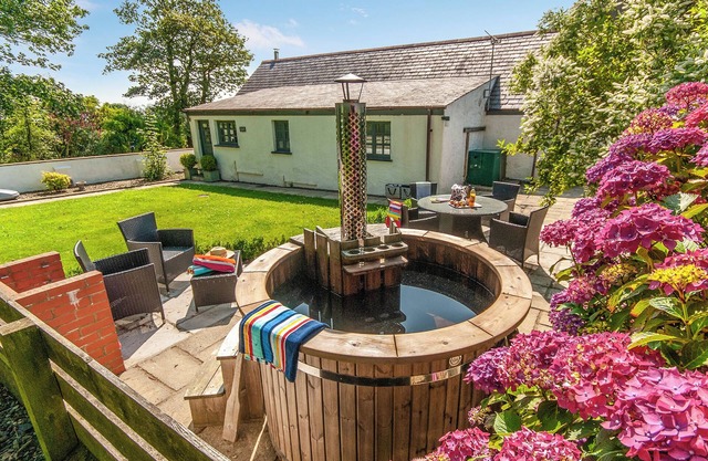 Luxurious Pembrokeshire farm cottage with a wood fired hot tub and sauna.