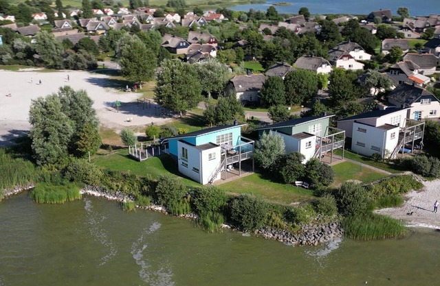 Luxury 6-person beach villa with a sauna, bathtub, and balcony overlooking the IJsselmeer at Beach Resort Makkum.
