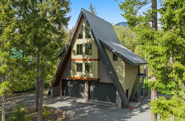 Luxury A-Frame Lodge on a river, surrounded by mountains