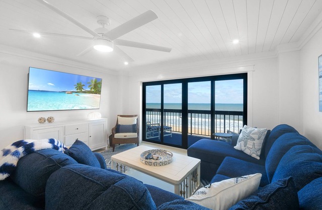 Luxury direct oceanfront corner with large private balcony, heated pool and garage