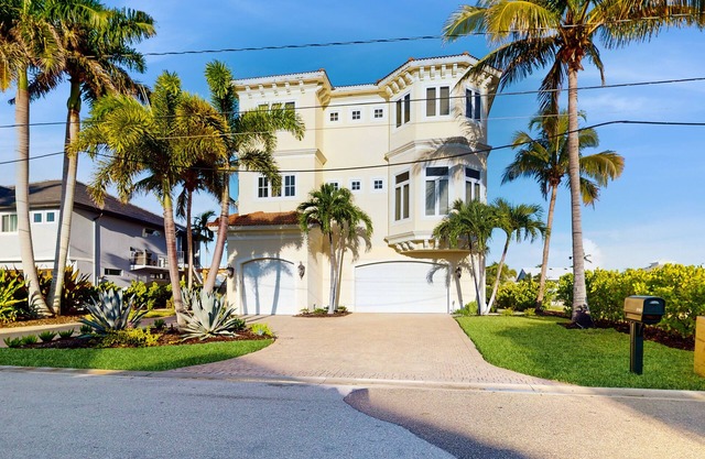Luxury home boasting waterfront views with pool and golf simulator