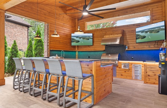 Luxury Lakefront retreat. Privacy gate, pool and outdoor kitchen